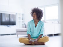 Black women using tablet computer on the floor at home royalty free stock image Black women using tablet computer on the floor at home royalty free stock image