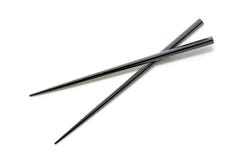 Black Wooden Chopsticks isolated on white background. Asian Food Stock Photo Black Wooden Chopsticks isolated on white background. Asian Food Stock Photo