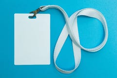 Blank badge mockup isolated on blue. Plain empty name tag with string royalty free stock image Blank badge mockup isolated on blue. Plain empty name tag with string royalty free stock image