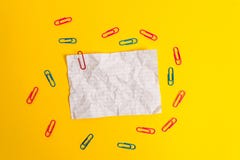 Blank colored crushed paper sheet binders clips holders light background. Empty notes important future events stationary stock images Blank colored crushed paper sheet binders clips holders light background. Empty notes important future events stationary stock images