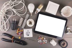 Blank digital tablet with electrical tools and equipment on wood stock photography Blank digital tablet with electrical tools and equipment on wood stock photography