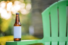 Blank Label Beer Bottle on Green Lawn Chair