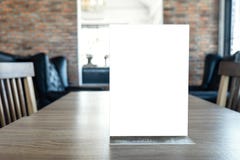 Blank screen mock up menu frame standing on wood table in coffee royalty free stock images Blank screen mock up menu frame standing on wood table in coffee royalty free stock images