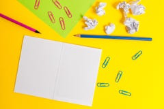 Blank squared notebook colored paper sheet crushed balls clips pencils highlighters markers ballpoint plain color stock photography Blank squared notebook colored paper sheet crushed balls clips pencils highlighters markers ballpoint plain color stock photography