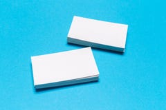 Blank white business cards on blue background. Mockup for branding identity stock images Blank white business cards on blue background. Mockup for branding identity stock images