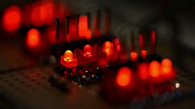 Blinking LEDs on a test PCB. Blinking red LEDs on a test PCB (close-up video Blinking LEDs on a test PCB. Blinking red LEDs on a test PCB (close-up video