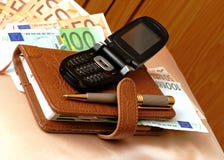 Blocknote, Cell Phone And Banknotes Stock Images