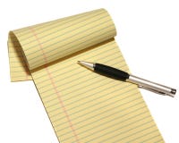 Bloco de notas e pena isolados em um fundo branco imagens de stock Bloco de notas e pena isolados em um fundo branco imagens de stock