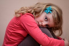 Blond Girl Holding Her Knees Royalty Free Stock Photos