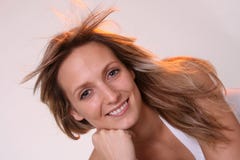 Blond Girl In Windy Area Royalty Free Stock Images