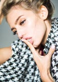 Blond woman in black and white suit suffering from headache. Girl with exhausted look isolated on gray background, party royalty free stock photos Blond woman in black and white suit suffering from headache. Girl with exhausted look isolated on gray background, party royalty free stock photos