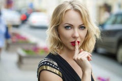 Blond Woman Has Put Forefinger To Lips As Sign Of Silence Royalty Free Stock Photography Blond Woman Has Put Forefinger To Lips As Sign Of Silence Royalty Free Stock Photography