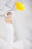 Blond Woman In White Dress With Big Yellow Flower Royalty Free Stock Image