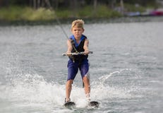 Blonde Boy Learning To Waterski On A Lake Stock Image Blonde Boy Learning To Waterski On A Lake Stock Image