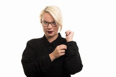 Blonde female teacher wearing glasses arranging shirt sleeve royalty free stock images Blonde female teacher wearing glasses arranging shirt sleeve royalty free stock images