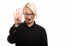 Blonde female teacher wearing glasses showing number four with f stock images Blonde female teacher wearing glasses showing number four with f stock images