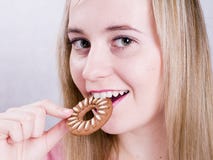 Blonde Girl Eating Cookie Royalty Free Stock Image