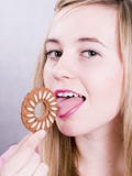 Blonde Girl Eating Cookie Stock Photo