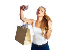 Blonde shopaholic Frau Taschen und Smartphone stockbild Blonde shopaholic Frau Taschen und Smartphone stockbild