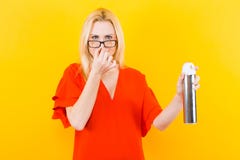 Blonde woman in dress with sprayer stock images Blonde woman in dress with sprayer stock images
