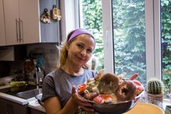 Blonde woman with a plate of russula mushroom stock photo Blonde woman with a plate of russula mushroom stock photo