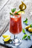 Bloody Mary cocktails with tomato juice and spicy vodka, decorated with pickle and olive garnish Royalty Free Stock Photo Bloody Mary cocktails with tomato juice and spicy vodka, decorated with pickle and olive garnish Royalty Free Stock Photo