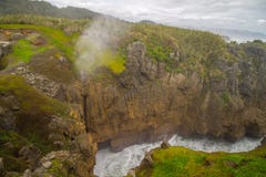 Blowhole Pancake Rocks near Hokatika with stormy weather royalty free stock image Blowhole Pancake Rocks near Hokatika with stormy weather royalty free stock image