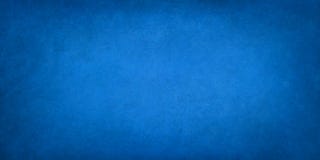 Blue background texture, old vintage textured paper or wallpaper with painted elegant solid blue color