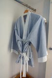Bathrobe hanging on rack in wardrobe at hotel room royalty free stock photos Bathrobe hanging on rack in wardrobe at hotel room royalty free stock photos