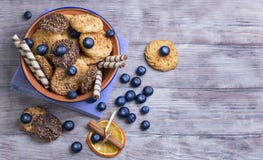 Blue ceramic bowl with cookies stock photos Blue ceramic bowl with cookies stock photos