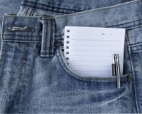 Blue Jeans And Notepad Stock Photos