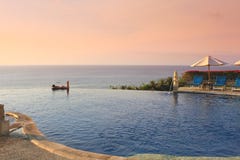 Blue Ocean With Swimming Pool Of Luxury Hotel Stock Photos