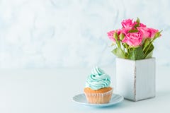 Blue Pastel Horizontal Banner With Decorated With Cream Cupcake And Pink Roses In Retro Shabby Chic Vase. Royalty Free Stock Image Blue Pastel Horizontal Banner With Decorated With Cream Cupcake And Pink Roses In Retro Shabby Chic Vase. Royalty Free Stock Image