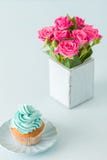Blue Pastel Vertical Banner With Decorated With Cream Cupcake And Bouquet Of Pink Roses In Retro Shabby Chic Vase. Royalty Free Stock Image Blue Pastel Vertical Banner With Decorated With Cream Cupcake And Bouquet Of Pink Roses In Retro Shabby Chic Vase. Royalty Free Stock Image