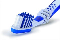 Blue plastic toothbrush is isolated on a white background stock photo Blue plastic toothbrush is isolated on a white background stock photo
