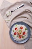 In a plate, rice noodles with tomatoes, king prawn and greens. View from above. Indoors. Royalty Free Stock Photo In a plate, rice noodles with tomatoes, king prawn and greens. View from above. Indoors. Royalty Free Stock Photo