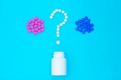 Blue and red pills question mark stock images Blue and red pills question mark stock images