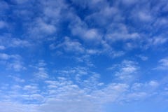 The blue sky begins to tighten with rain clouds stock image The blue sky begins to tighten with rain clouds stock image