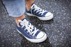 Blue Sneakers In The Rain Royalty Free Stock Photography