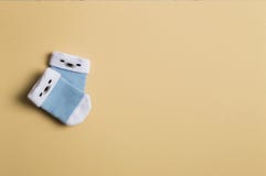 Blue socks for boy on the olive background. Baby shower. stock image Blue socks for boy on the olive background. Baby shower. stock image
