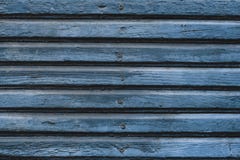 Blue wooden planks with nails. Old wood boards texture. Wooden blue fence surface. Old wooden plank background. Natural painted ta stock photo Blue wooden planks with nails. Old wood boards texture. Wooden blue fence surface. Old wooden plank background. Natural painted ta stock photo