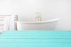 Blue Wooden Shelf And Towels On Bathroom Background. Wood Desk Table With Top View And Copy Space Near White Bath At Hotel. Room Royalty Free Stock Image Blue Wooden Shelf And Towels On Bathroom Background. Wood Desk Table With Top View And Copy Space Near White Bath At Hotel. Room Royalty Free Stock Image