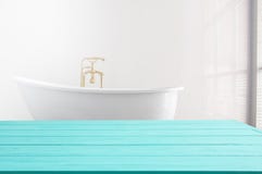 Blue Wooden Shelf On Bathroom Background. Wood Desk Table With Top View And Copy Space Near White Bath At Hotel. Room Service Royalty Free Stock Photos Blue Wooden Shelf On Bathroom Background. Wood Desk Table With Top View And Copy Space Near White Bath At Hotel. Room Service Royalty Free Stock Photos