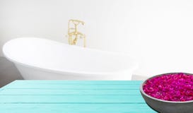 Blue Wooden Shelf On Bathroom Background. Wood Desk Table With Top View And Copy Space Near White Bath At Hotel. Room Service Stock Photography Blue Wooden Shelf On Bathroom Background. Wood Desk Table With Top View And Copy Space Near White Bath At Hotel. Room Service Stock Photography