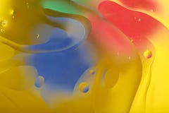 Blurred abstract background. Image of red, blue, green and yellow circles and wavy lines of different sizes. stock photo Blurred abstract background. Image of red, blue, green and yellow circles and wavy lines of different sizes. stock photo