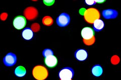 Blurred background with colorful bokeh lights on dark purple and blue background/blurred Christmas lights Royalty Free Stock Photo Blurred background with colorful bokeh lights on dark purple and blue background/blurred Christmas lights Royalty Free Stock Photo