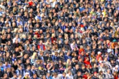 Blurred crowd of spectators on a stadium tribune Stock Photography Blurred crowd of spectators on a stadium tribune Stock Photography
