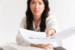Blurry photo of tense asian woman employee with long dark hair h royalty free stock photography Blurry photo of tense asian woman employee with long dark hair h royalty free stock photography
