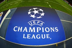 Board with UEFA Champions League Logo on the ground