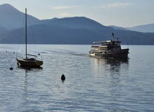 Boat approaching at Lake (lago) Maggiore stock photo Boat approaching at Lake (lago) Maggiore stock photo